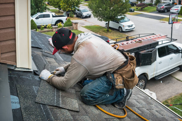 Professional Gutter Repair And Installation technician working in Bay City, TX